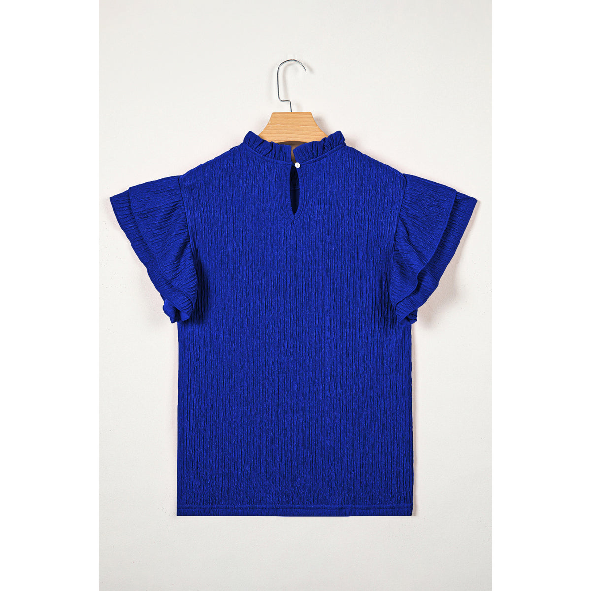 Blusa blu scuro in tessuto lavorato con maniche a volant — vista posteriore