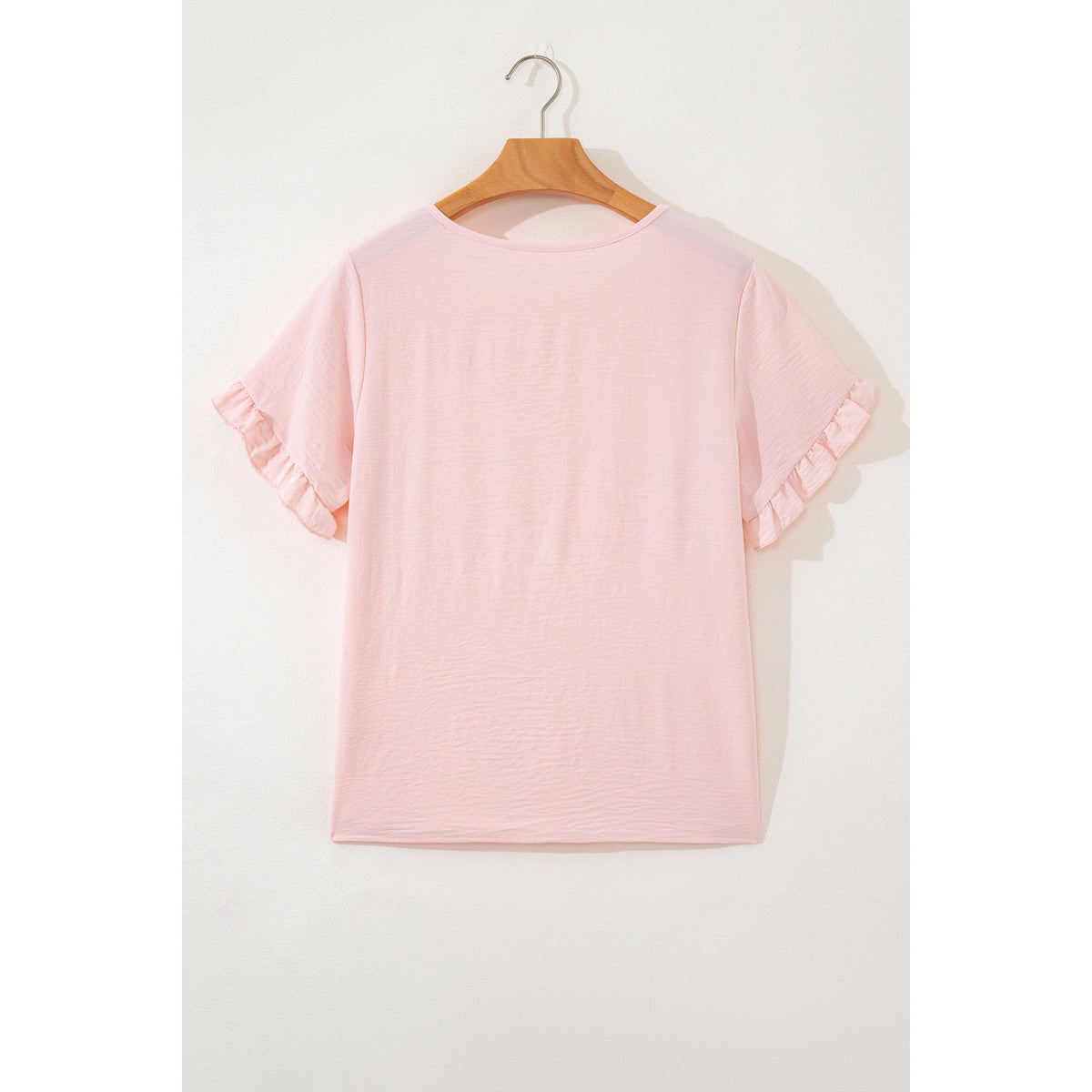 Blusa rosa chiaro con maniche a volant — vista posteriore