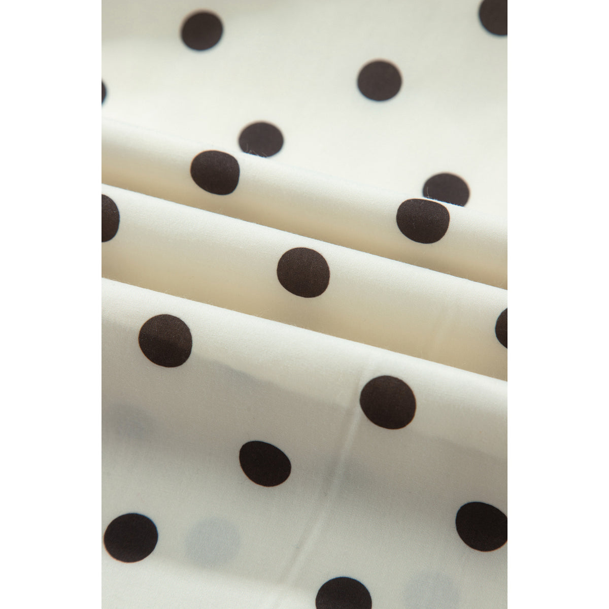 Gonna lunga beige a pois con vita arricciata — dettaglio del tessuto a pois