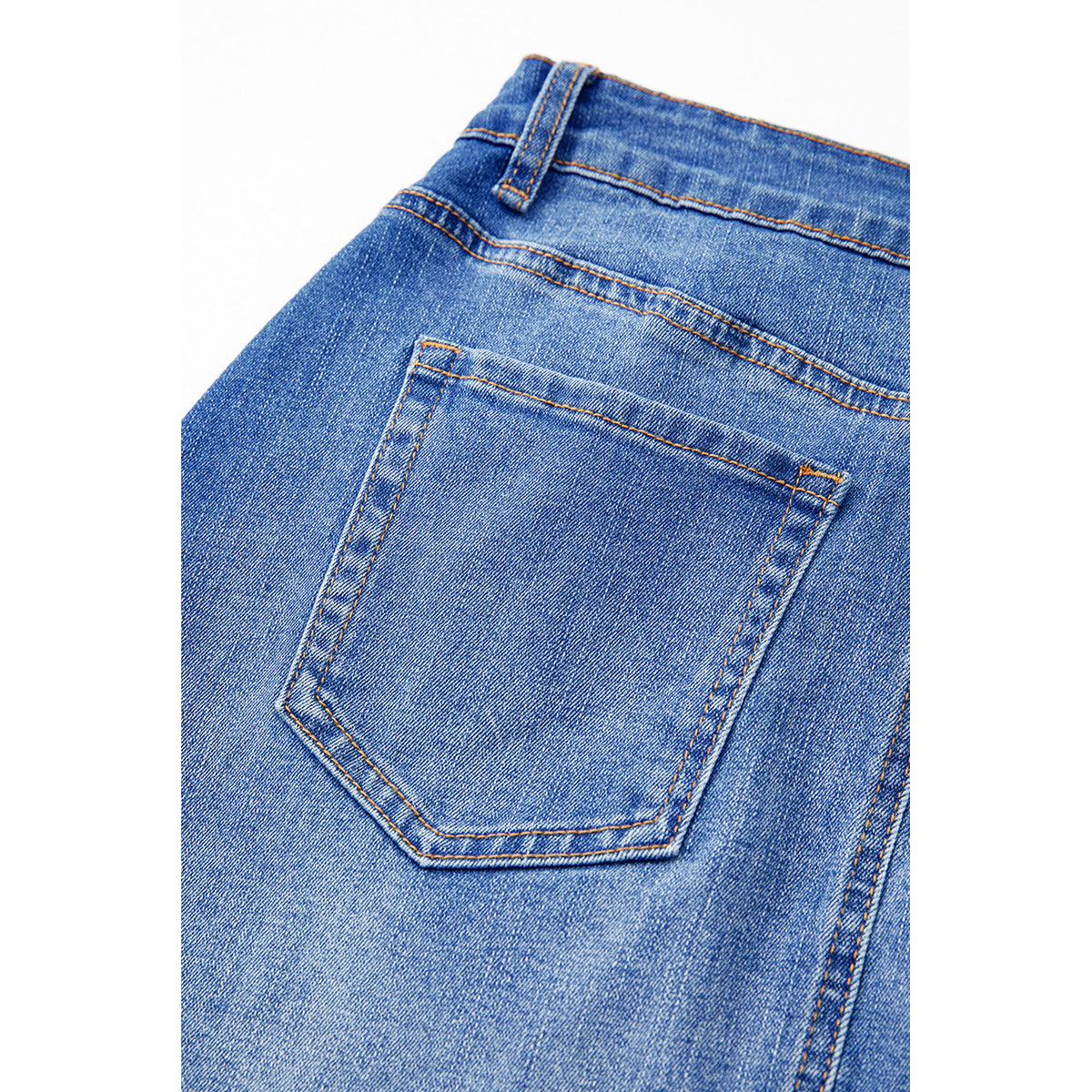 Minigonna in denim blu con vita incrociata — dettaglio della tasca posteriore