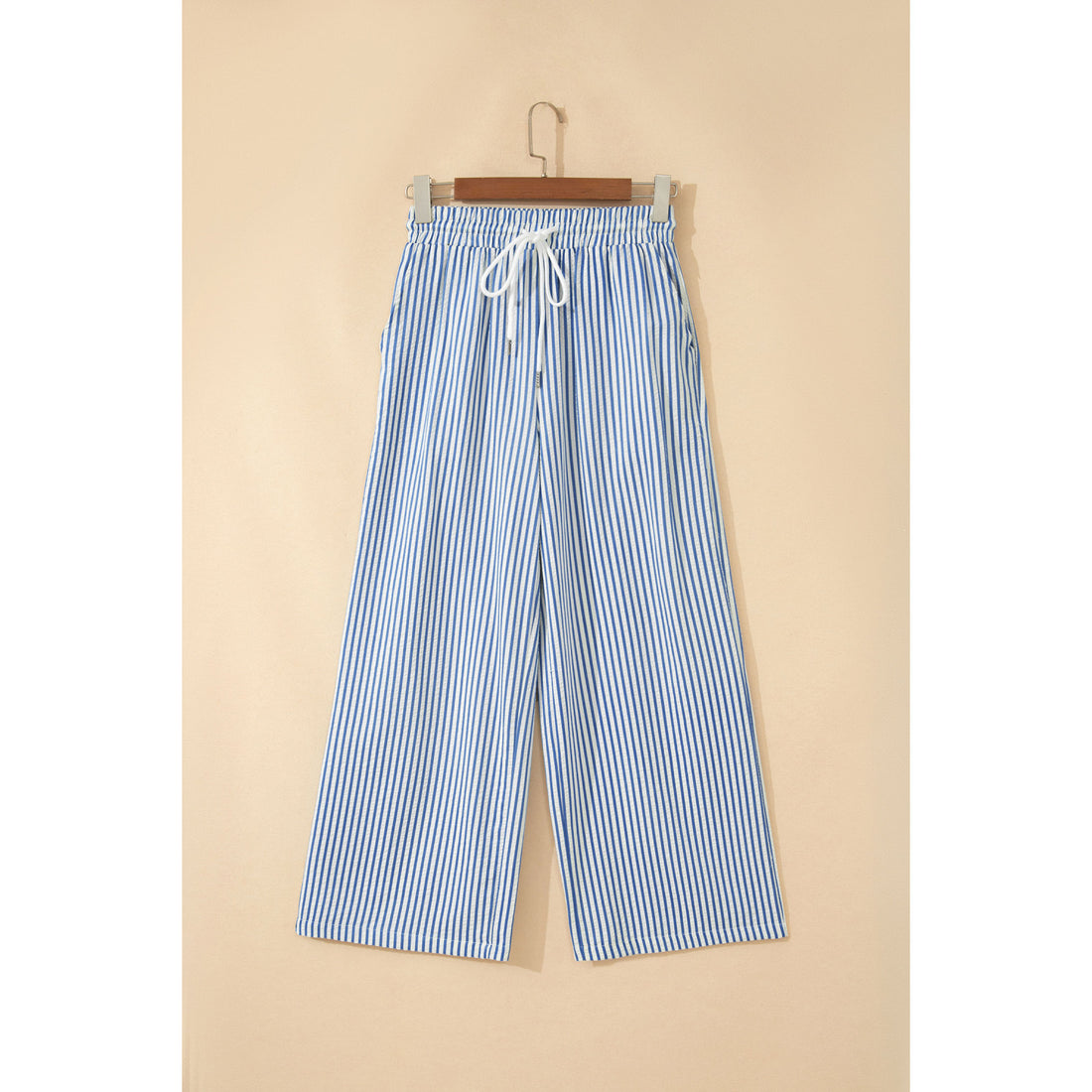 Pantaloni alla caviglia a righe blu con coulisse — vista frontale